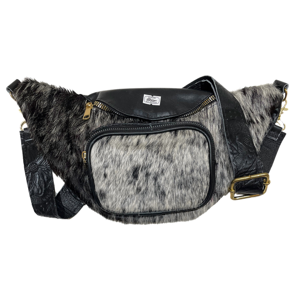Black cow hair leather fanny pack with genuine cowhide exterior, leather trim, zippered compartments, and adjustable strap. 