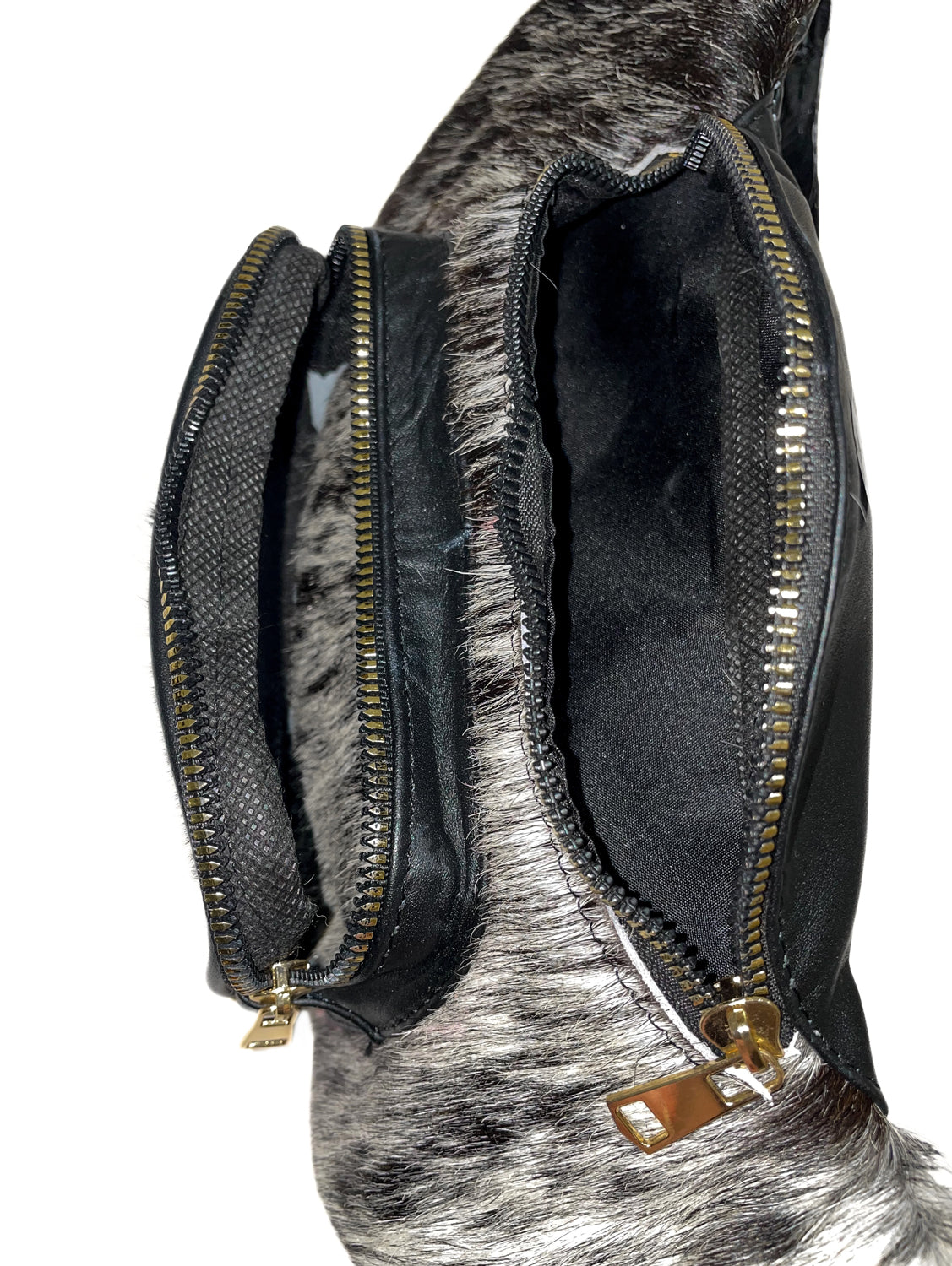 Black cowhide leather waist bag with zippered main compartment and spacious interior for everyday essentials. 