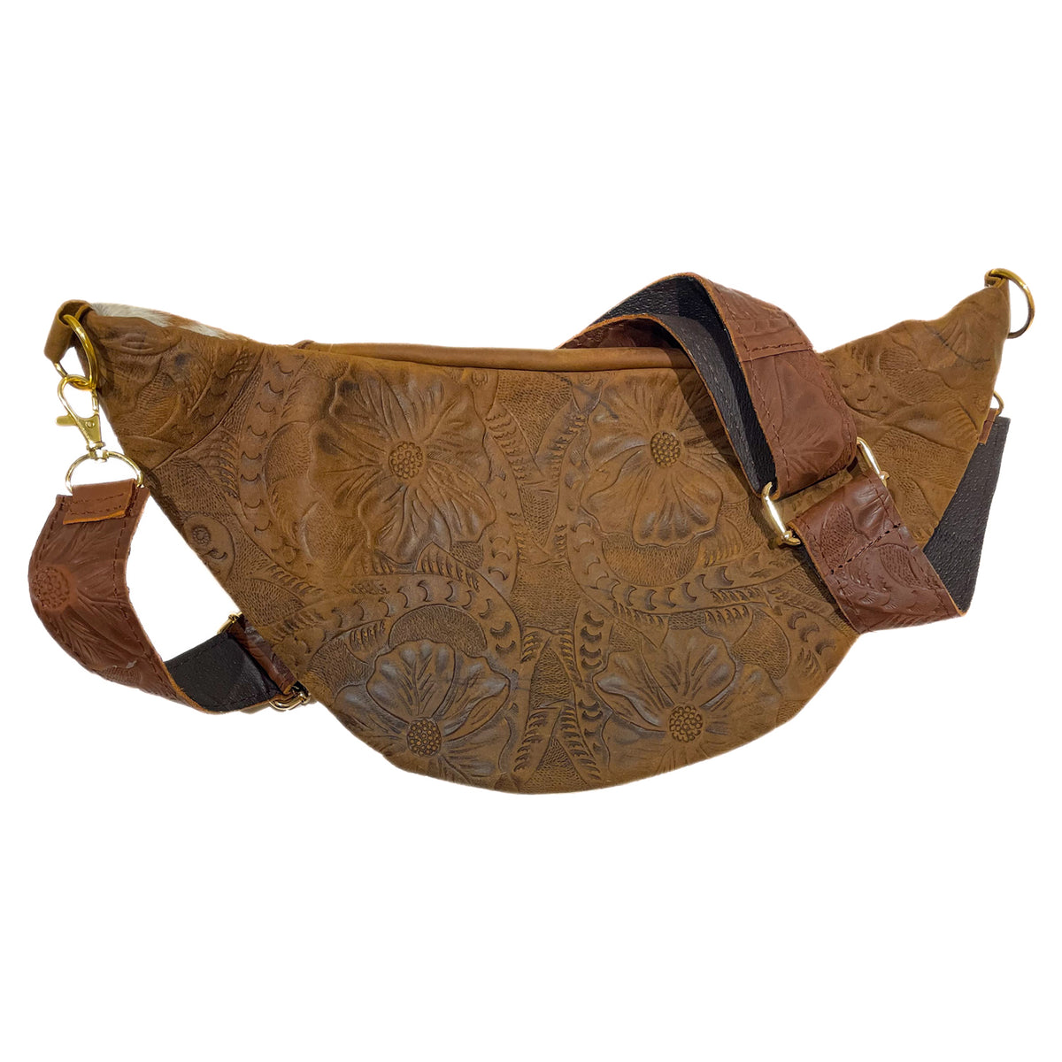 Back of light brown cow hair leather fanny pack showing adjustable tooled leather strap and gold-tone hardware. 