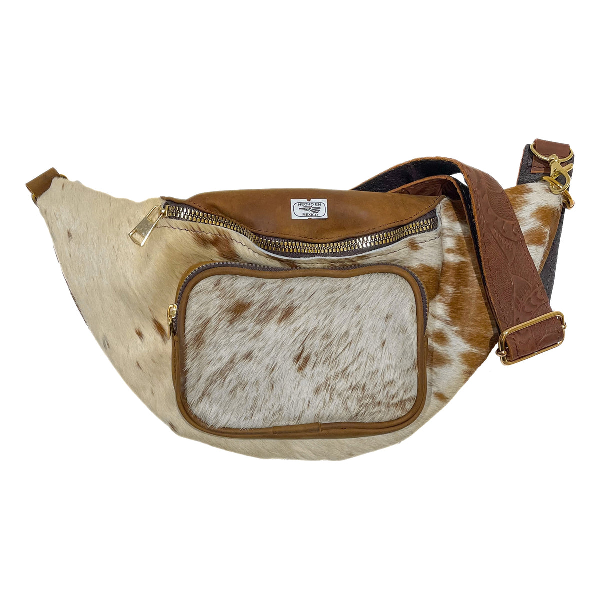 Light brown cow hair leather fanny pack with genuine cowhide exterior, brown leather trim, zippered compartments, and adjustable strap. 