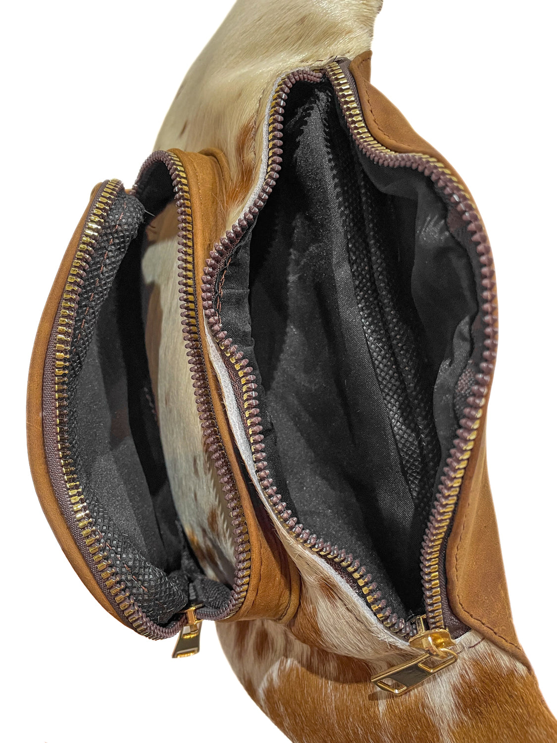 Light brown cowhide leather waist bag with zippered main compartment for carrying everyday essentials hands-free. 