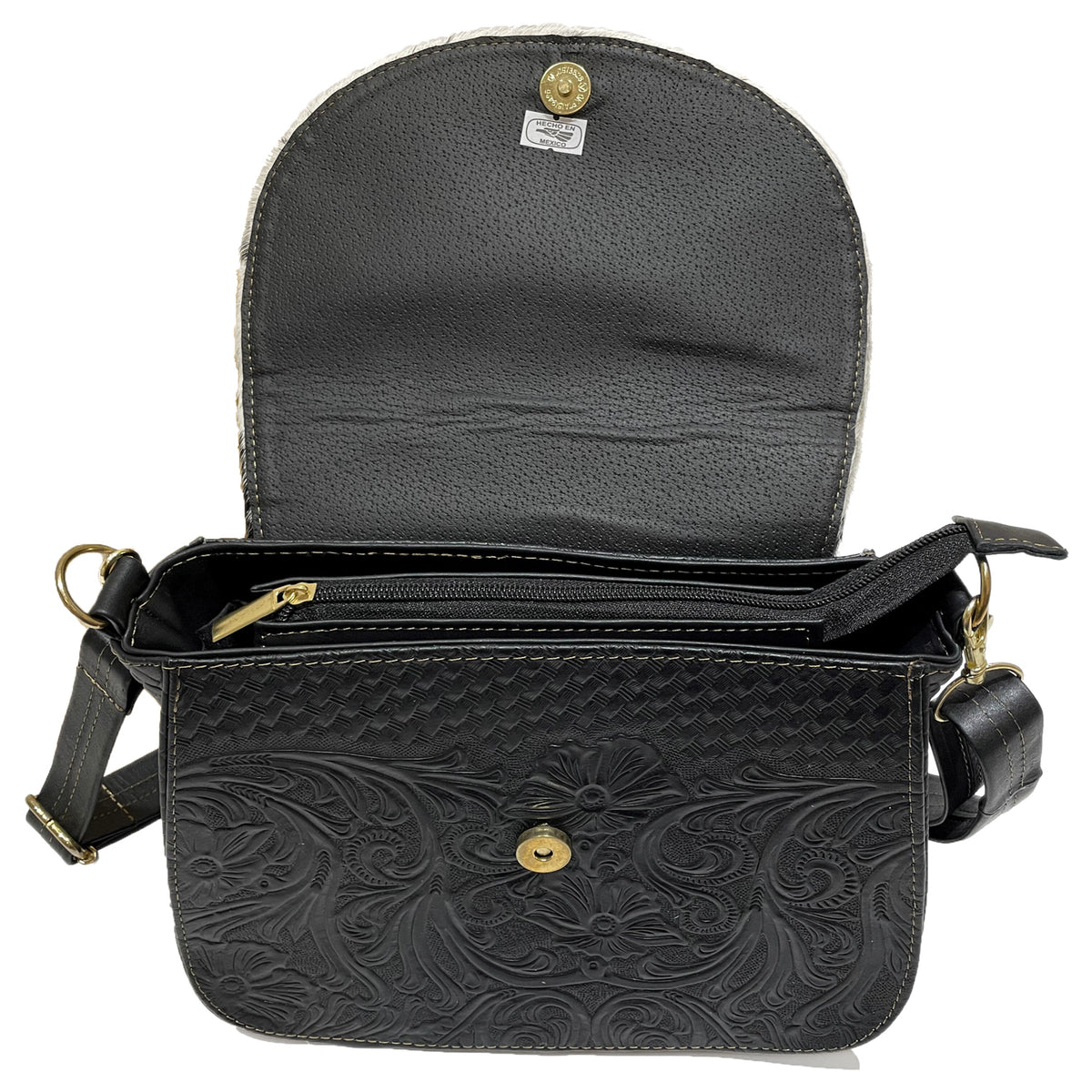 Leather bag made in Mexico with detailed patterns and gold hardware 