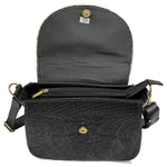 Leather bag made in Mexico with detailed patterns and gold hardware 