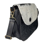 cowhide leather crossbody bag with tooled floral design 