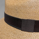 Close-up of Tan-Brown Fedora Fino showing handwoven Mexican palm leaf craftsmanship and the natural texture of the straw. 