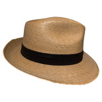 Side view of the Tan-Brown Fedora Fino worn as a lightweight Mexican palm leaf fedora for travel, outdoor adventures, beach days, and summer style. 