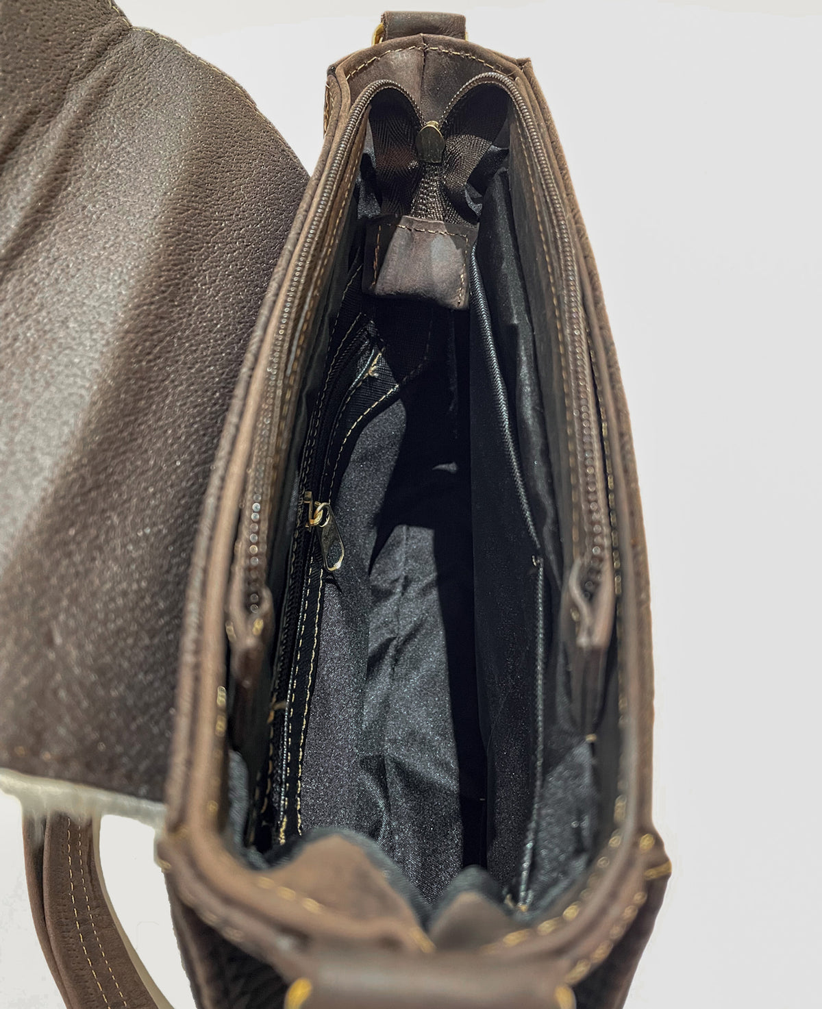 Inside cow leather bag with zipper closure and zipper and open compartments inside 