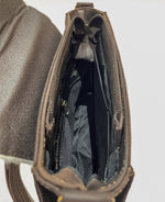 Inside cow leather bag with zipper closure and zipper and open compartments inside 