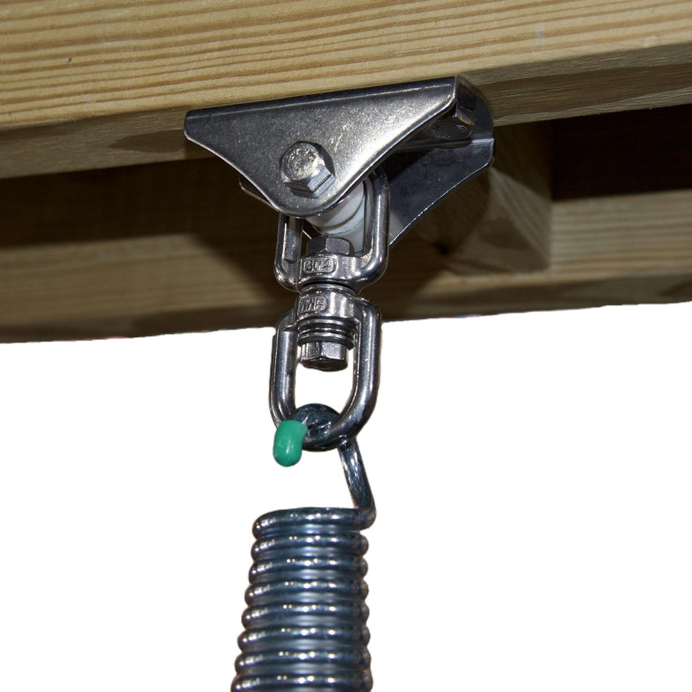 Metal spring clamp attached to wooden beams with a white background