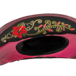 Detailed shot of Mexican artisanal floral embroidery on a handwoven pink authentic western hat 